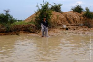 Fisherman, Floating village at Kampong Phluk, Cambodia 