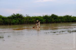 A fisherman, Floating village at Kampong Phluk, Cambodia