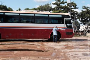 Washing the bus at the lunch stop.
