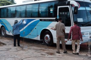 Washing the bus at the lunch stop.
