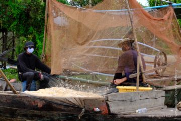 Fishermen, Floating village at Kampong Phluk, Cambodia